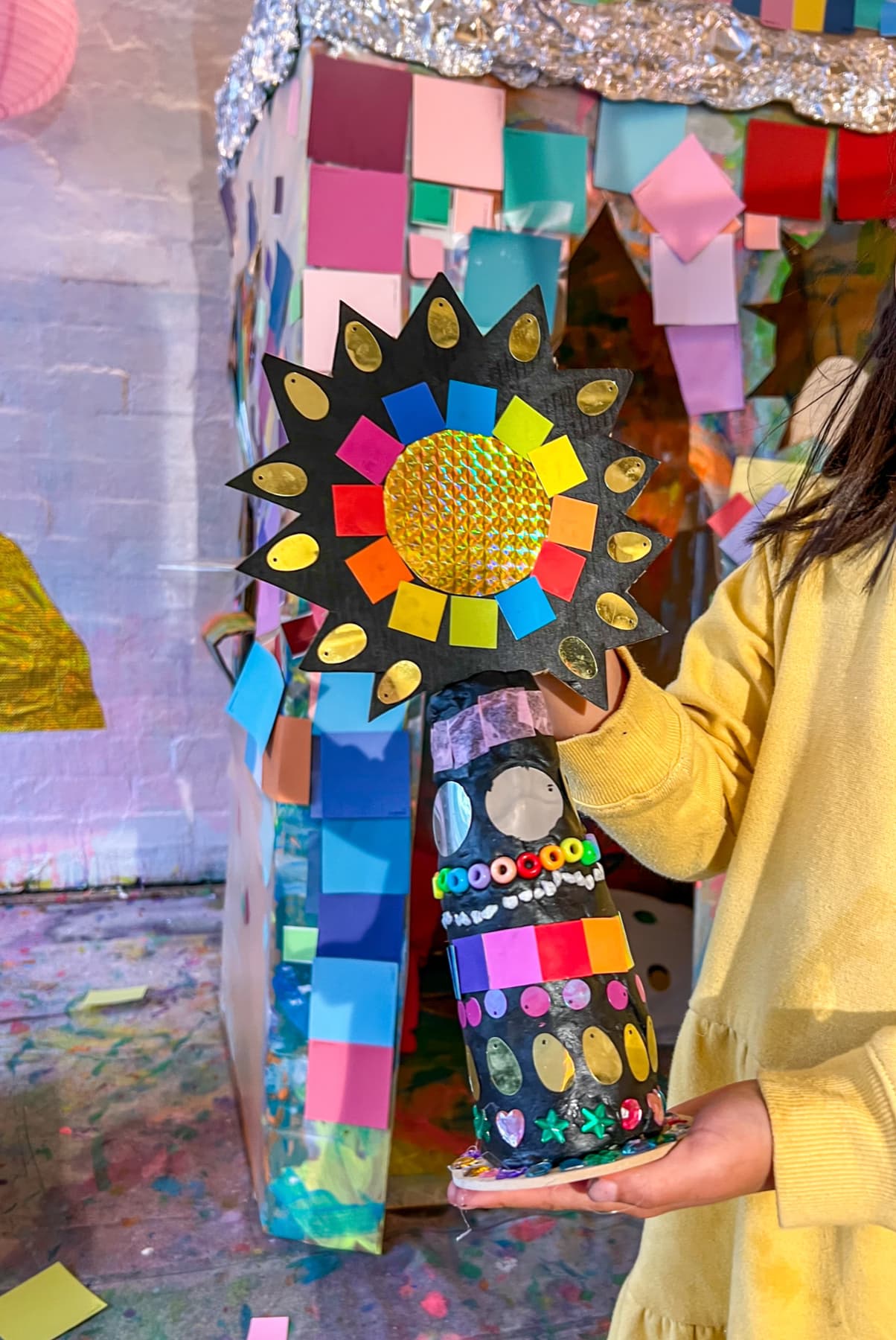 Girl with sculpture by mosaic arch