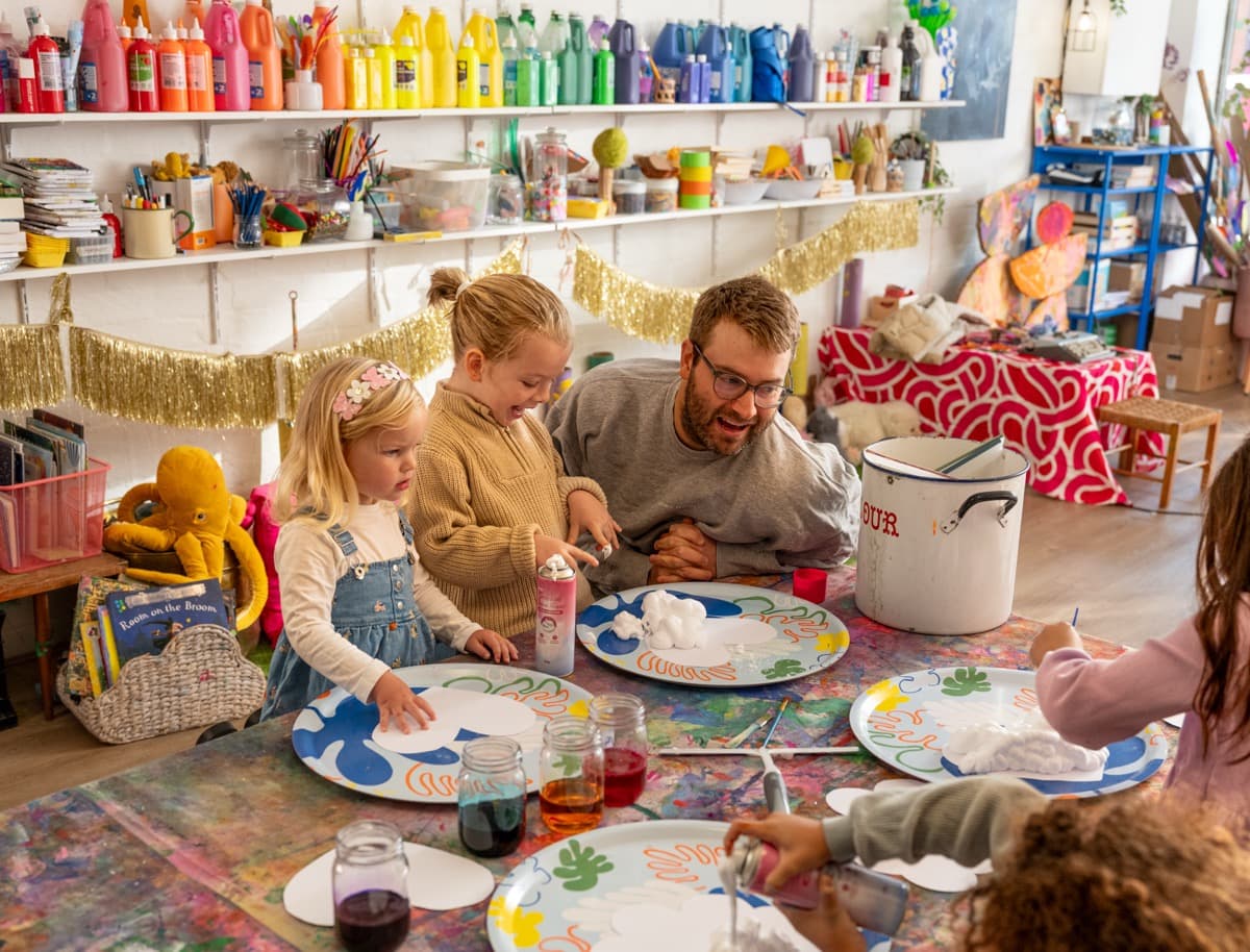 Family painting together at a Smudge party